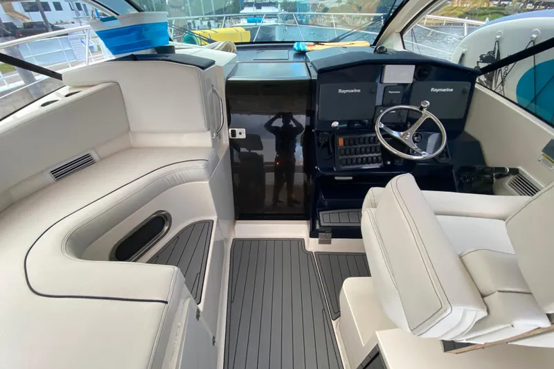 Slide: The Image of 2014 Pursuit SC 365i Sport Coupe cockpit with modern controls and seating. - 29