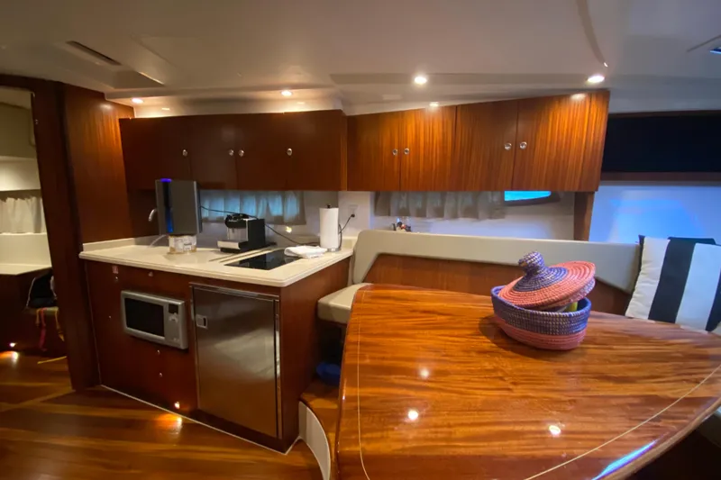 Slide: The Image of Interior of 2014 Pursuit SC 365i Sport Coupe with modern kitchen and dining area. - 49