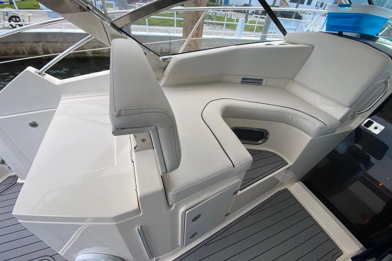 Slide: The Image of 2014 Pursuit SC 365i Sport Coupe interior seating with sleek white upholstery. - 30