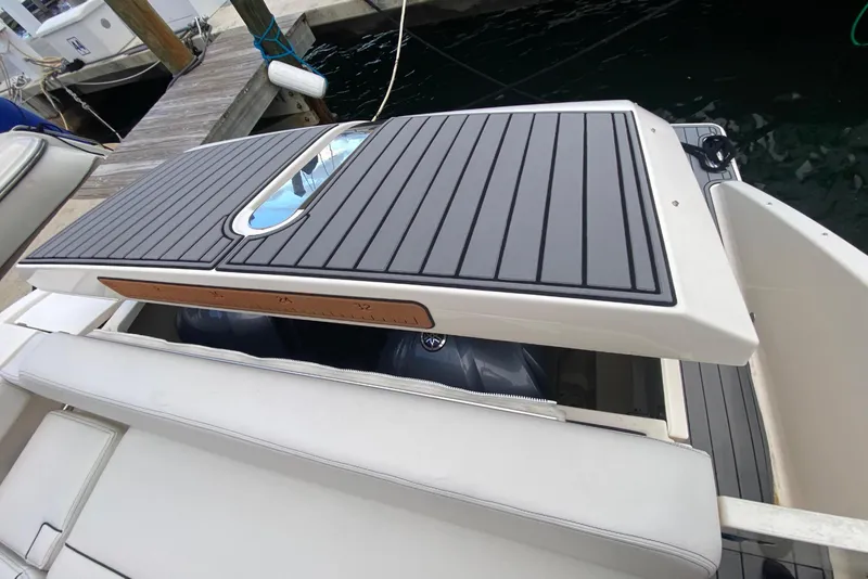 Slide: The Image of 2014 Pursuit SC 365i Sport Coupe boat deck with sleek design and modern features. - 60