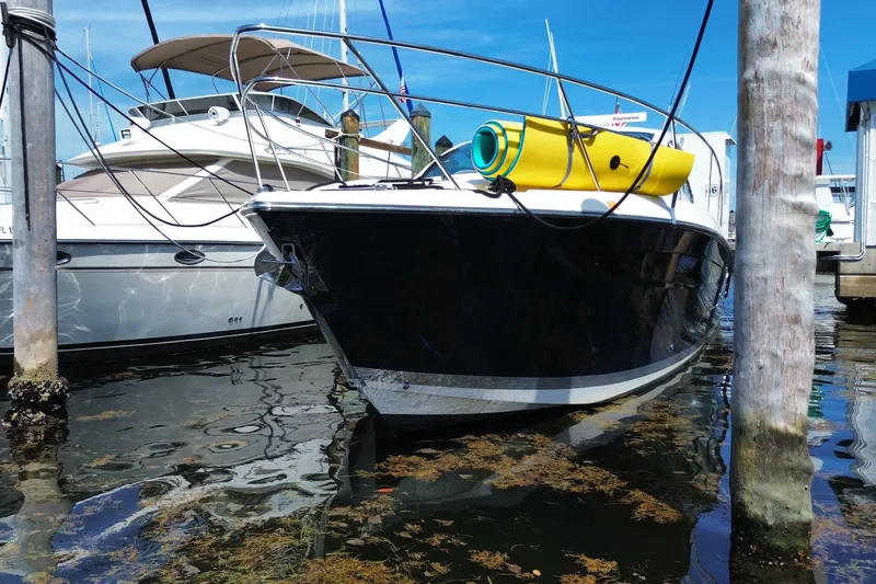 Slide: The Image of 2014 Pursuit SC 365i Sport Coupe docked with yellow float on deck. - 70