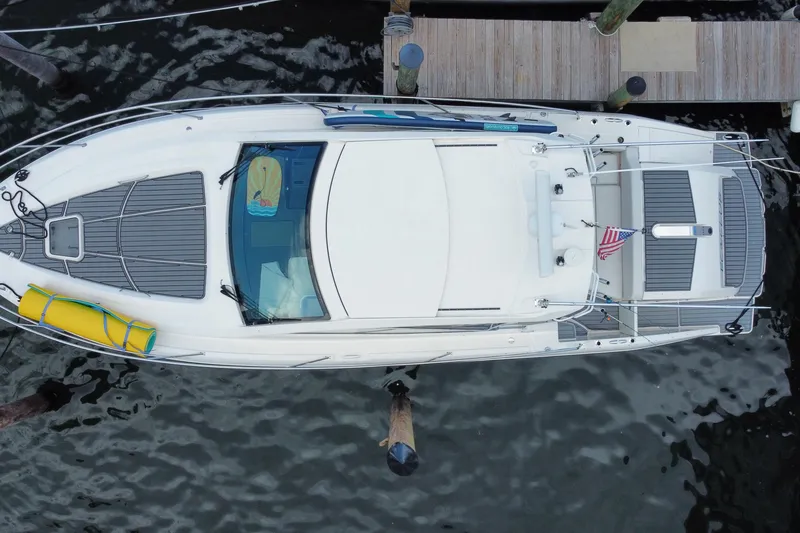 Slide: The Image of Overhead view of 2014 Pursuit SC 365i Sport Coupe docked at a marina. - 75