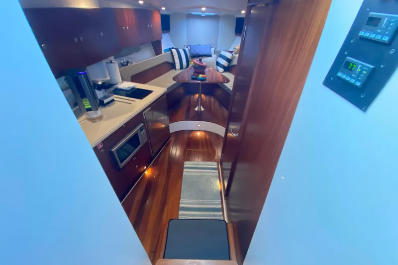 Slide: The Image of Interior of 2014 Pursuit SC 365i Sport Coupe, featuring modern kitchen and cozy seating area. - 40