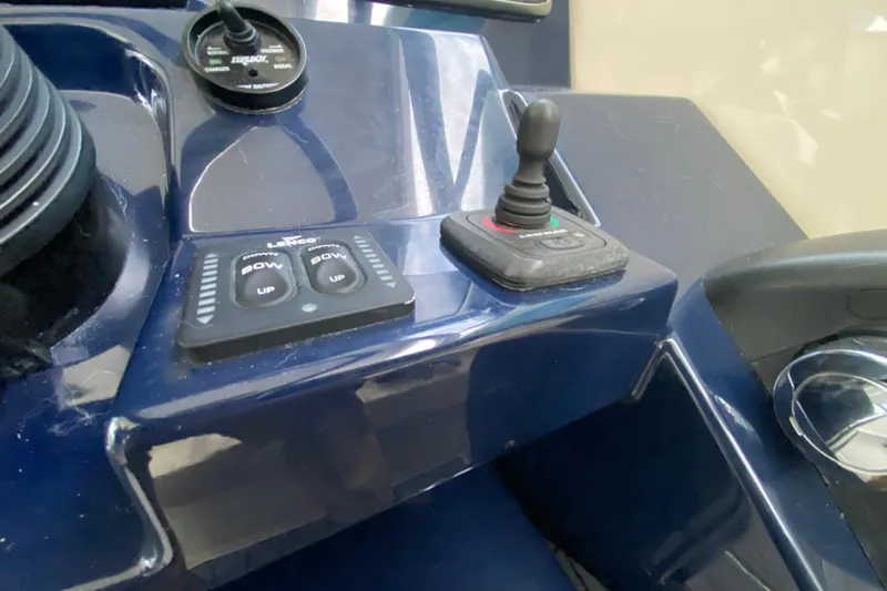 Slide: The Image of Control panel of a 2014 Pursuit SC 365i Sport Coupe with joystick and buttons. - 36