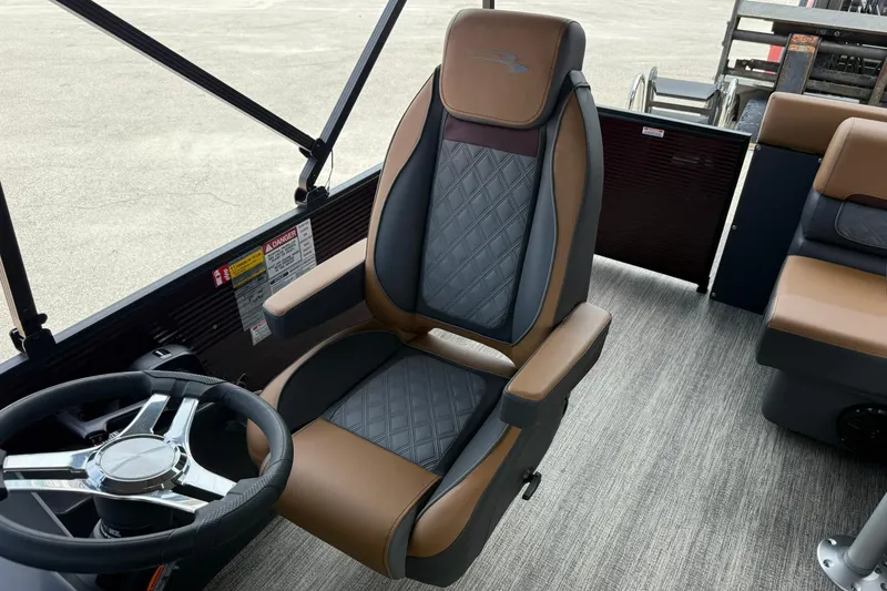 Slide: The Image of Captain's chair in 2026 Bennington 21 SLJ pontoon boat, featuring luxurious brown and black upholstery. - 13