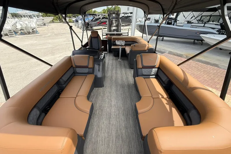Slide: The Image of 2026 Bennington 21 SLJ pontoon boat interior with tan seating and spacious layout. - 17
