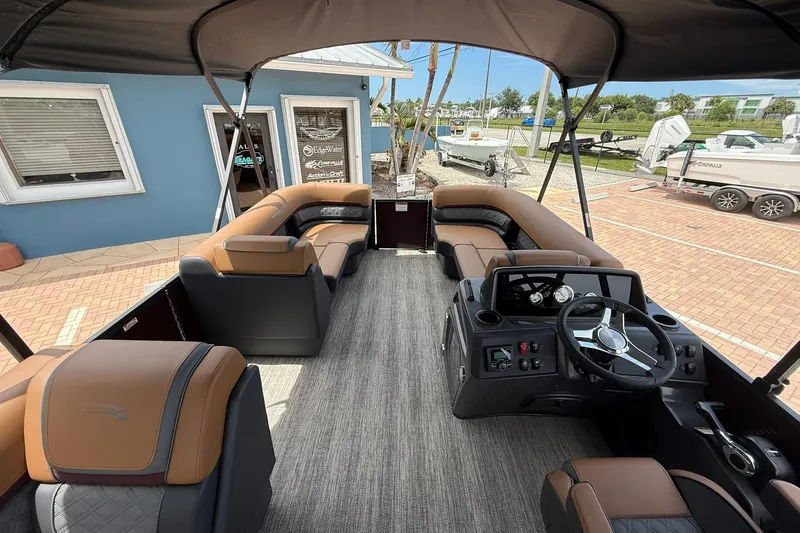 Slide: The Image of 2026 Bennington 21 SLJ pontoon boat interior with luxurious seating and modern dashboard. - 10
