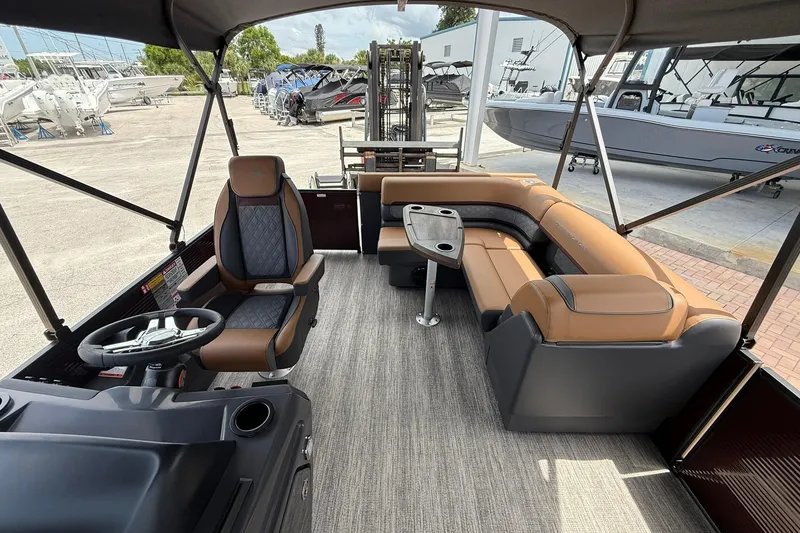 Slide: The Image of Interior of 2026 Bennington 21 SLJ pontoon boat with luxurious seating and steering console. - 14