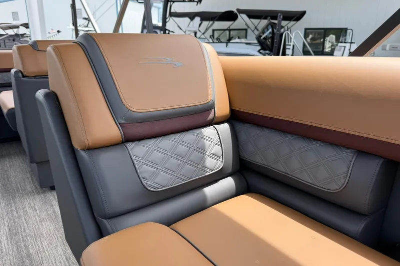Slide: The Image of Luxurious seating in the 2026 Bennington 21 SLJ pontoon boat, featuring elegant leather upholstery. - 18