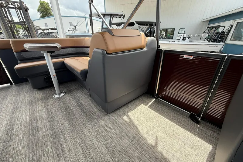 Slide: The Image of Interior of 2026 Bennington 21 SLJ pontoon boat with plush seating and modern design. - 15