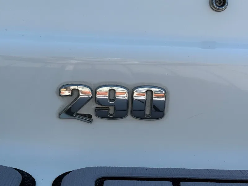 Slide: The Image of Close-up of the "290" model badge on a Sea Ray SDX 290 boat. - 6