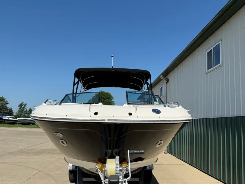 Slide: The Image of A 2017 Sea Ray SDX 290 on a trailer in front of a building. - 3