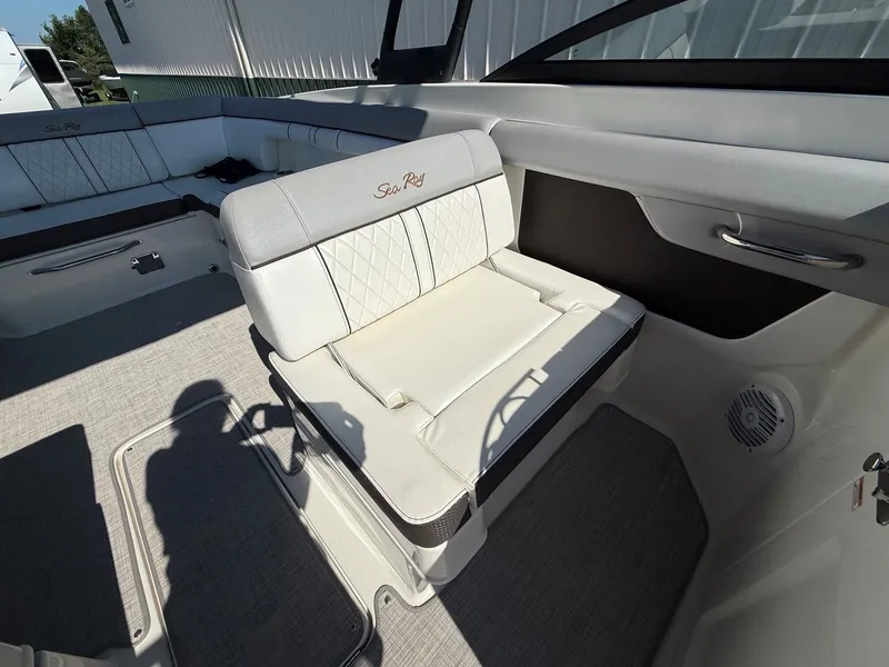 Slide: The Image of The image shows the interior of a 2017 Sea Ray SDX 290 boat with elegant seating. - 16