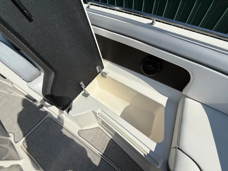 Slide: The Image of An open storage compartment on a 2017 Sea Ray SDX 290 boat. - 14