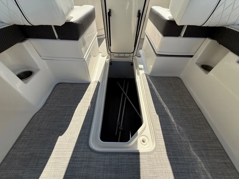 Slide: The Image of Floor storage compartment on a 2017 Sea Ray SDX 290 boat. - 30
