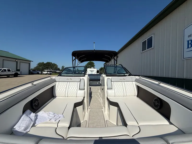 Slide: The Image of The image shows the interior of a 2017 Sea Ray SDX 290 boat with white seating. - 4