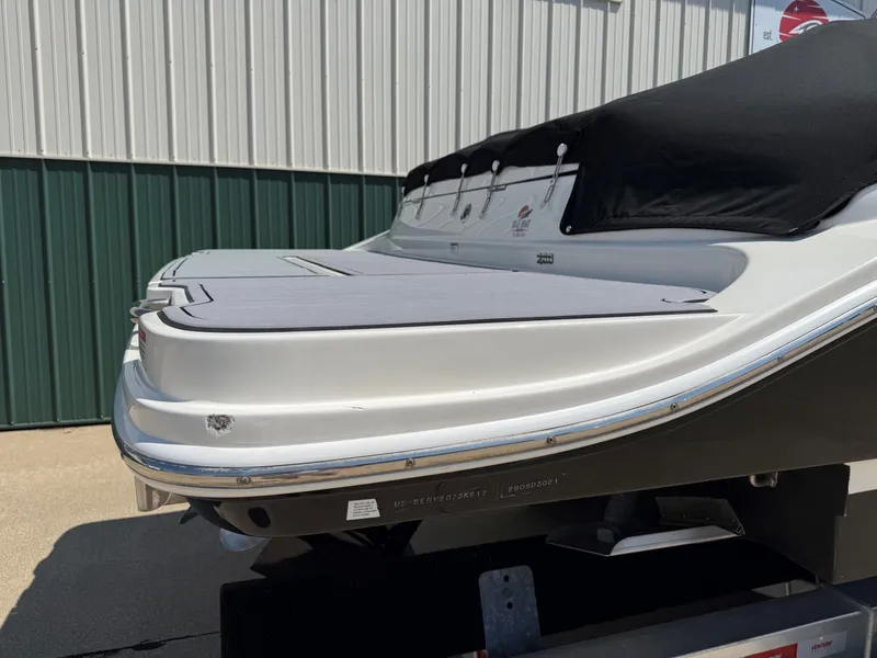Slide: The Image of The image shows the rear of a 2017 Sea Ray SDX 290 boat on a trailer. - 8