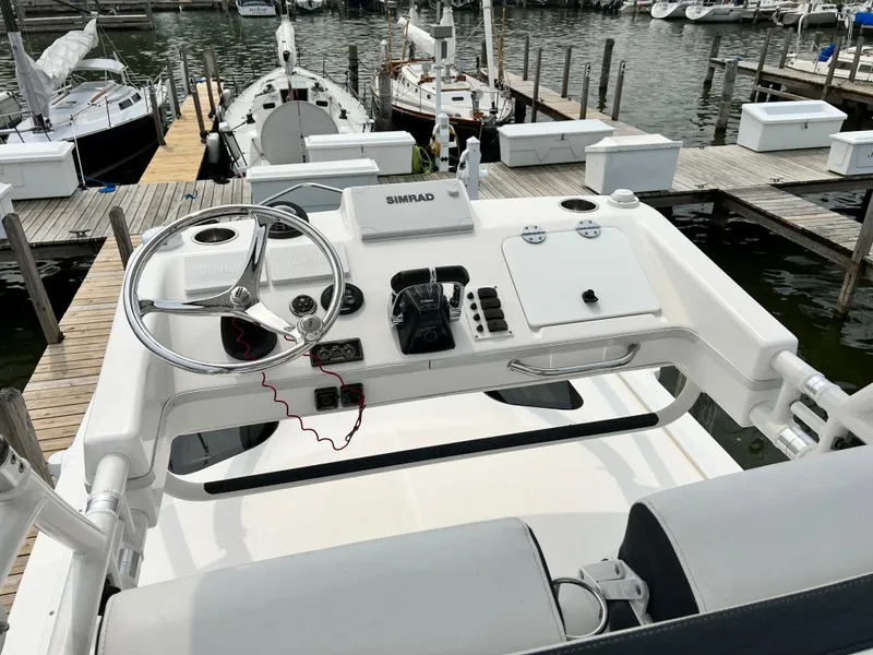 Slide: The Image of Cockpit view of 2012 Everglades 350LX boat at marina dock. - 43