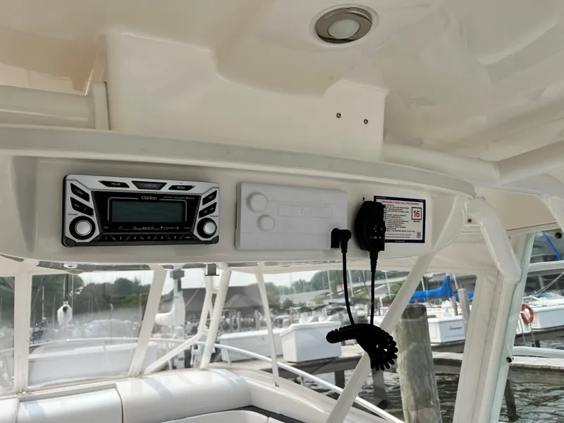 Slide: The Image of Interior view of a 2012 Everglades 350LX boat with radio and control panel. - 38