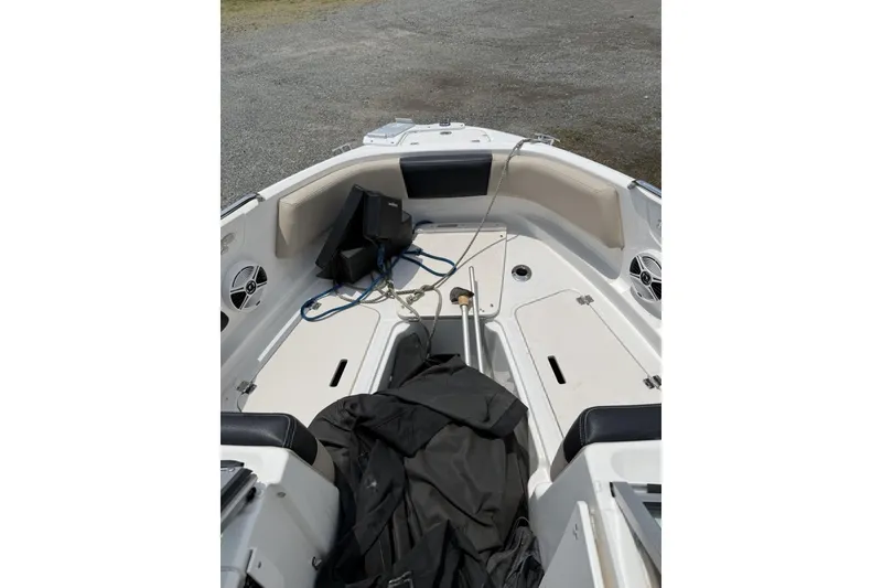 Slide: The Image of 2018 Chaparral 21 H2O Ski & Fish OB boat interior with seating and storage compartments. - 7