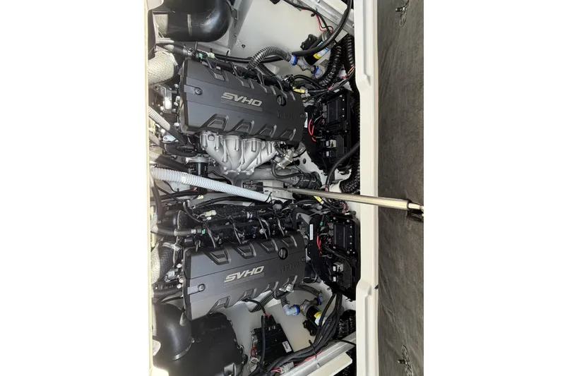 Slide: The Image of 2026 Yamaha Boats 255XE engine compartment with dual SVHO engines. - 4