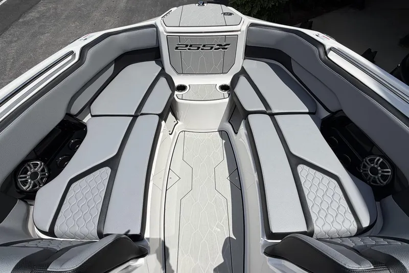 Slide: The Image of 2026 Yamaha Boats 255XE interior with sleek seating and modern design. - 10