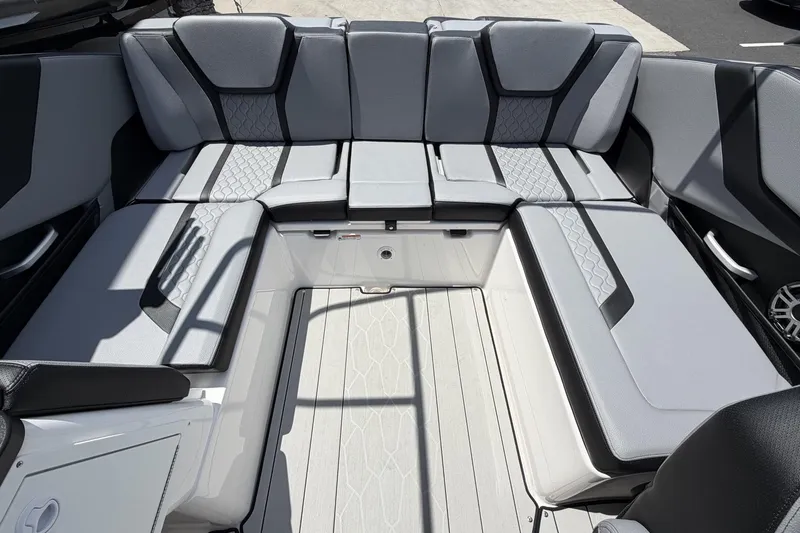 Slide: The Image of 2026 Yamaha Boats 255XE interior with sleek, modern seating and stylish design. - 6