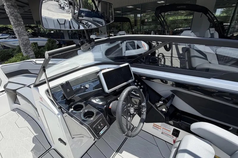 Slide: The Image of 2026 Yamaha Boats 255XE cockpit with modern dashboard and steering wheel design. - 5