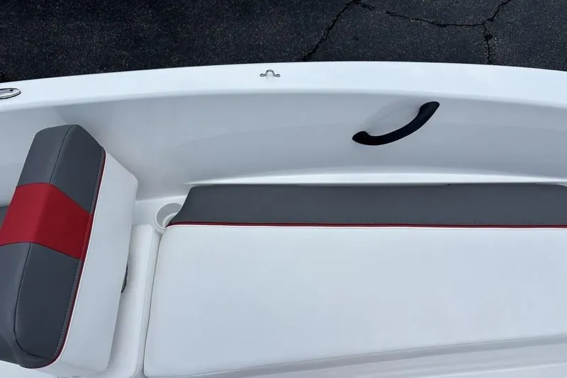 Slide: The Image of 2024 Tahoe T18 boat interior with gray and red cushioned seating. - 17