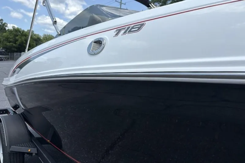 Slide: The Image of 2024 Tahoe T18 boat side view with sleek design and modern detailing. - 8