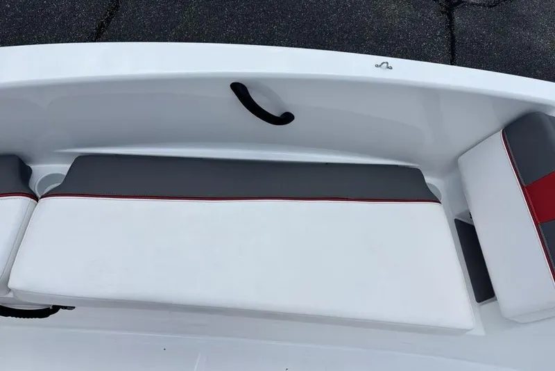 Slide: The Image of 2024 Tahoe T18 boat seating with white and gray upholstery, featuring red accents. - 13