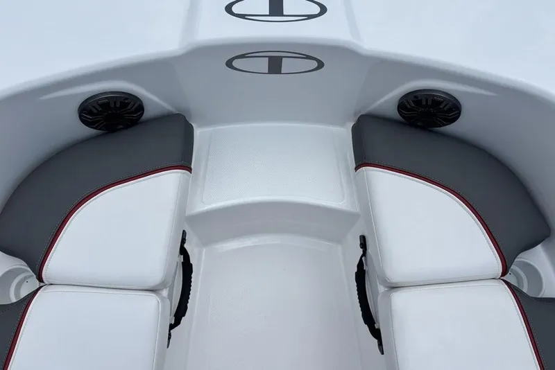 Slide: The Image of 2024 Tahoe T18 boat interior with white and gray seating, featuring speakers. - 9