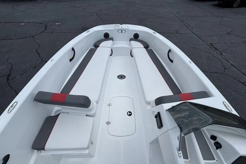 Slide: The Image of 2024 Tahoe T18 boat interior with white and gray seating, red accents, and a sleek design. - 31