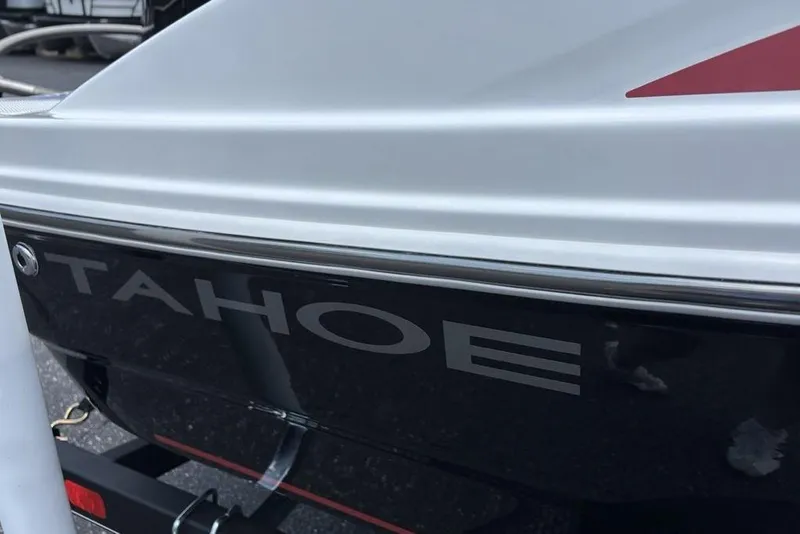 Slide: The Image of 2024 Tahoe T18 boat close-up, showcasing sleek design and branding. - 7