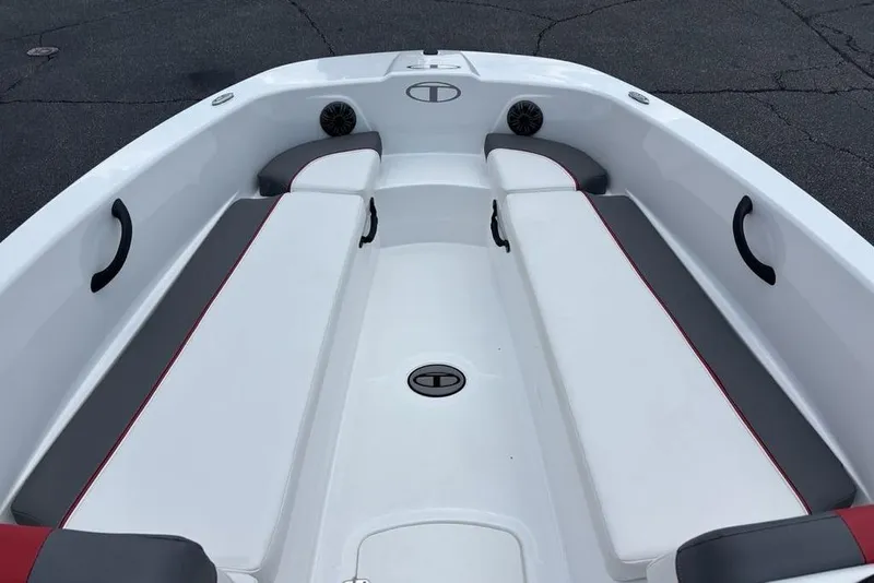 Slide: The Image of 2024 Tahoe T18 boat interior with white and gray seating, featuring red accents. - 27