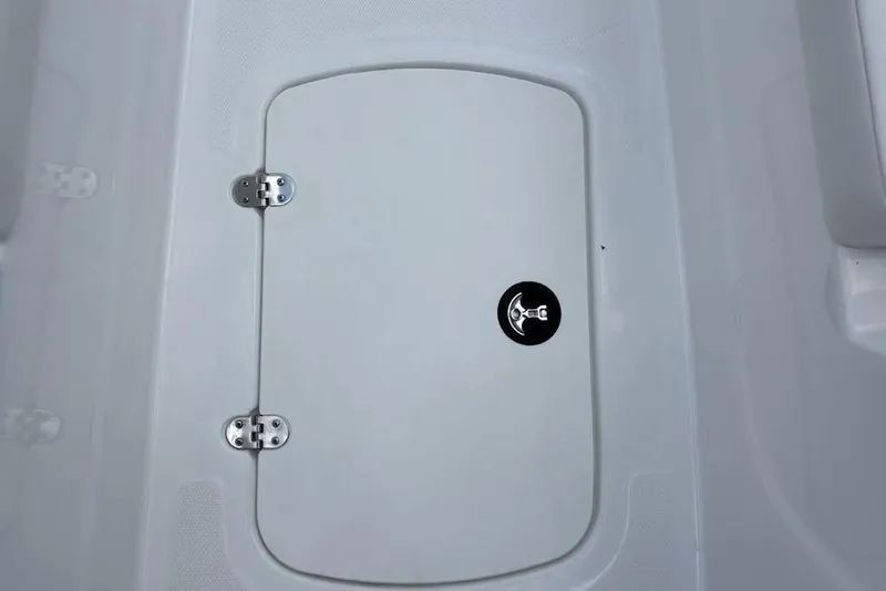 Slide: The Image of 2024 Tahoe T18 boat storage compartment with secure latch and hinges. - 24