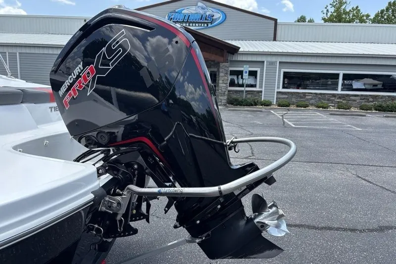 Slide: The Image of 2024 Tahoe T18 boat with Mercury Pro XS outboard motor in parking lot. - 5
