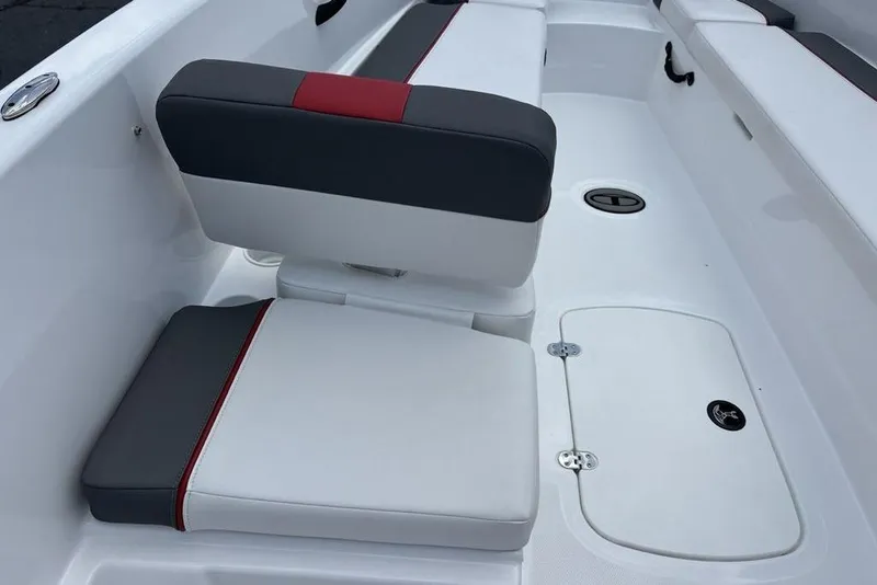 Slide: The Image of 2024 Tahoe T18 boat interior with white and gray seating, featuring red accents. - 21