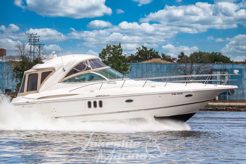 Slide: The Image of A 2006 Cruisers Yachts 420 Express speeding on the water. - 2