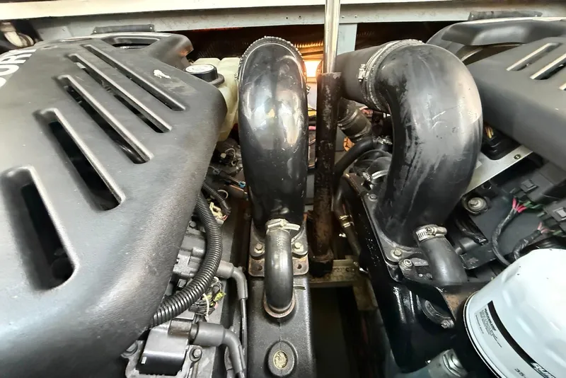 Slide: The Image of Engine compartment of a 2001 Sea Ray 340 Sundancer, showcasing dual engines and components. - 23