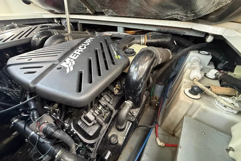 Slide: The Image of Engine compartment of a 2001 Sea Ray 340 Sundancer with Mercury engine components. - 22