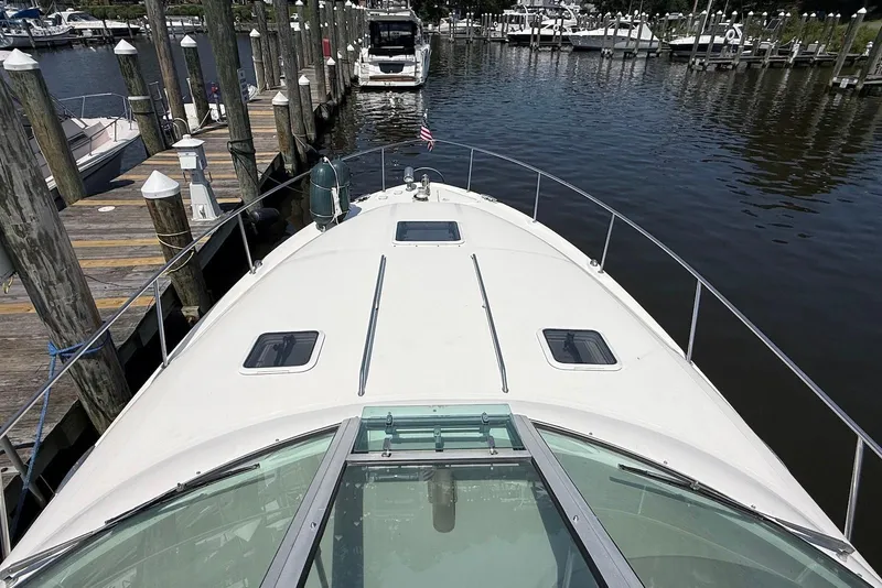 Slide: The Image of 2001 Sea Ray 340 Sundancer docked at marina, view from bow. - 4