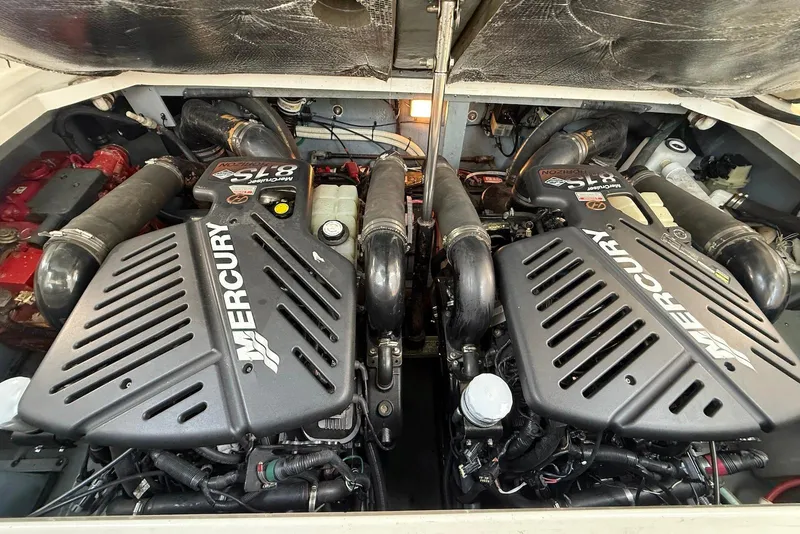 Slide: The Image of Twin Mercury engines in a 2001 Sea Ray 340 Sundancer boat engine compartment. - 21