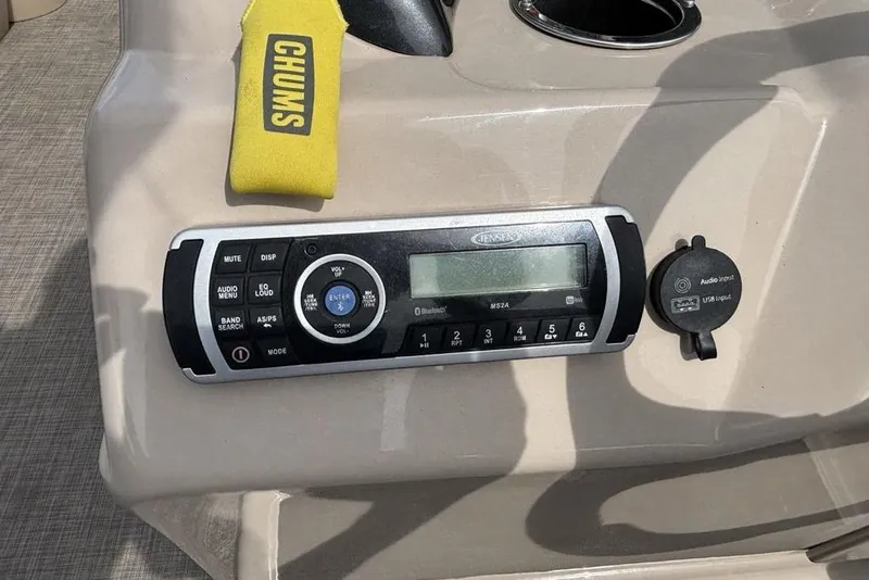 Slide: The Image of Control panel of a 2019 Sun Tracker Party Barge 22 RF DLX with audio system and USB input. - 16