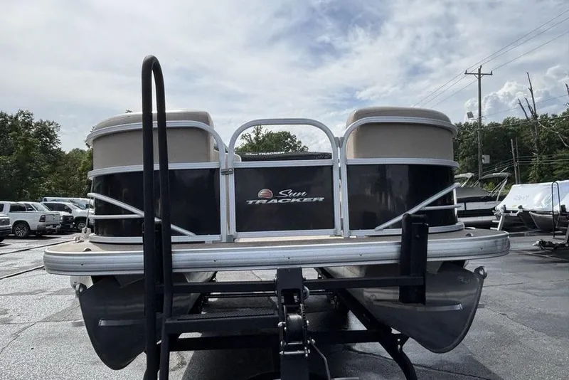 Slide: The Image of 2019 Sun Tracker Party Barge 22 RF DLX pontoon boat on trailer, parked outdoors. - 3