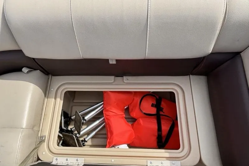 Slide: The Image of Storage compartment on 2019 Sun Tracker Party Barge 22 RF DLX with life jackets and equipment. - 6