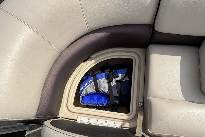 Slide: The Image of Storage compartment on 2019 Sun Tracker Party Barge 22 RF DLX with life jacket inside. - 9