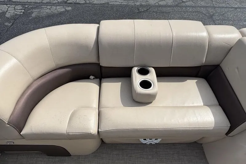 Slide: The Image of 2019 Sun Tracker Party Barge 22 RF DLX beige seating with cup holders. - 20