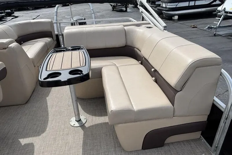 Slide: The Image of 2019 Sun Tracker Party Barge 22 RF DLX with beige seating and a central table. - 17