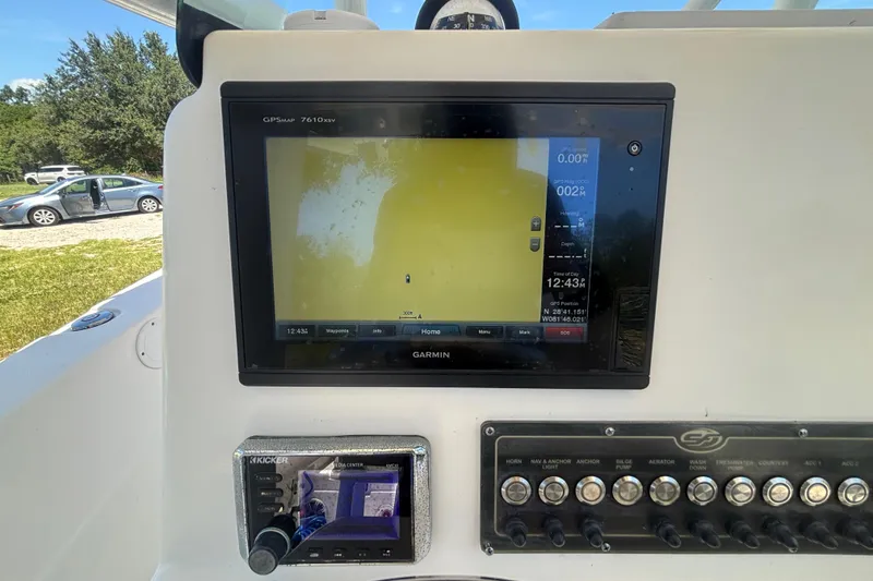 Slide: The Image of Garmin GPS display on 2016 Sea Fox 249 Avenger boat dashboard, showing navigation details. - 22